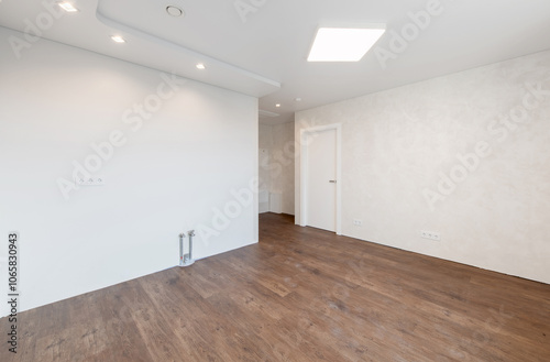 Empty Home Kitchen Interior. White Walls Room. Interior Empty Room with White Walls and Wooden Floor.
