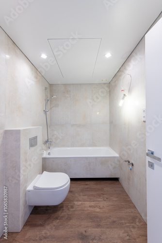 Bright Elegant Modern Bathroom Interior Design of Shower With White Sink. Marble Tiled Walls and Faucet. LED Lights. Under Construction