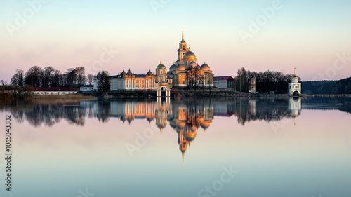 a soft pink dawn and a view of the Nilo-Stolobensky monastery