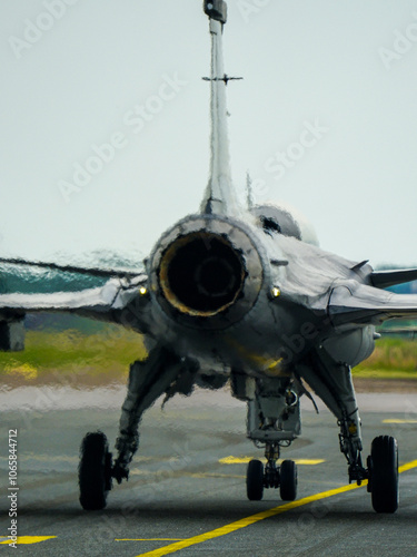 Swirling hot air behind the turbine exhaust of a working fighter jet, blurred photo