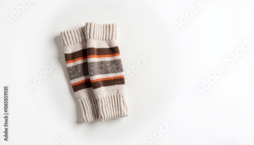 Striped knitted leg warmers on white background for winter fashion accessories photo