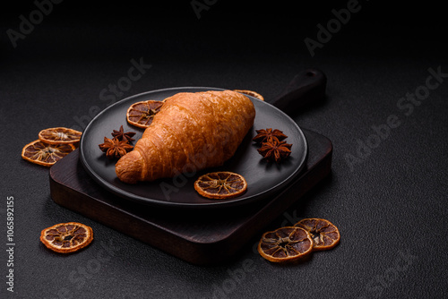 Golden crispy croissant with a sweet creamy fruit filling