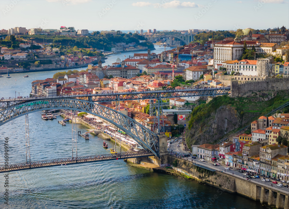 Obraz premium Aerial drone view of Dom Luis I Bridge over Douro river and panoramic Porto view. Portugal city landscape