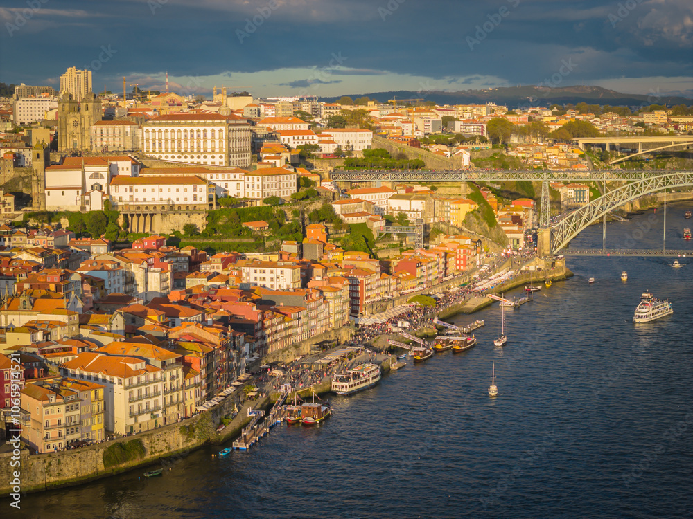 Fototapeta premium Aerial drone view of Dom Luis I Bridge over Douro river and panoramic Porto view. Portugal city landscape