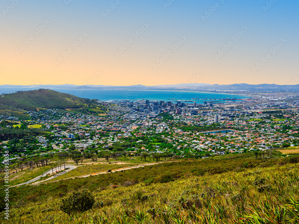 Fototapeta premium Cape Town city view from Table Mountain, featuring Atlantic Ocean and clear blue sky, South Africa