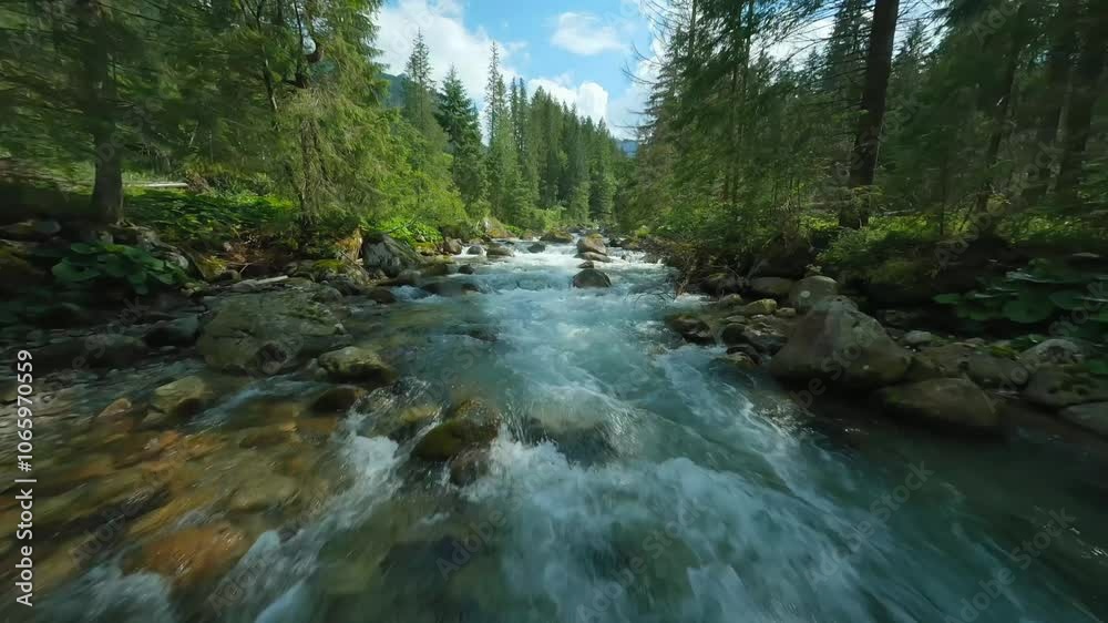 Flight over a mountain river. Shot on FPV drone. Tatra Mountains, Slovakia.