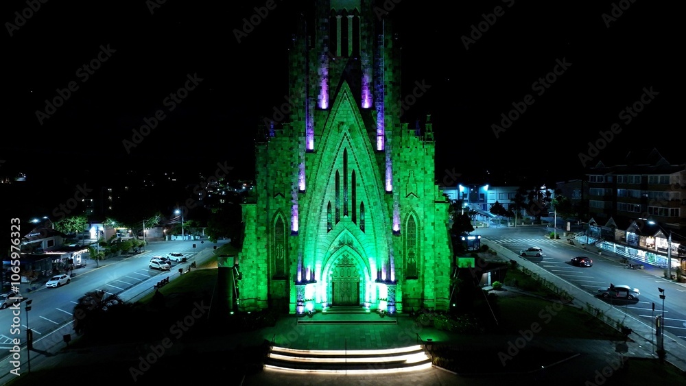 Naklejka premium Canela Brazil. Catholic Church At Canela In Rio Grande Do Sul Brazil. Illuminated Church. Landmark Building. Light Projection Scenery. Catholic Church At Canela In Rio Grande Do Sul Brazil. 