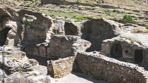 Views of uplistsikhe ancient rock town in country of Georgia stone walls photo