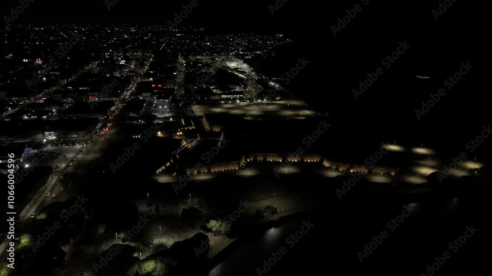 Drone flies over almost completely dark fort of Fortaleza Sao Jose de Macapá at night in Macapá, Amapá, Brazil Drone flies over almost completely dark fort of Fortaleza Sao Jose de Macapá at night in Macapá, Amapá, Brazil