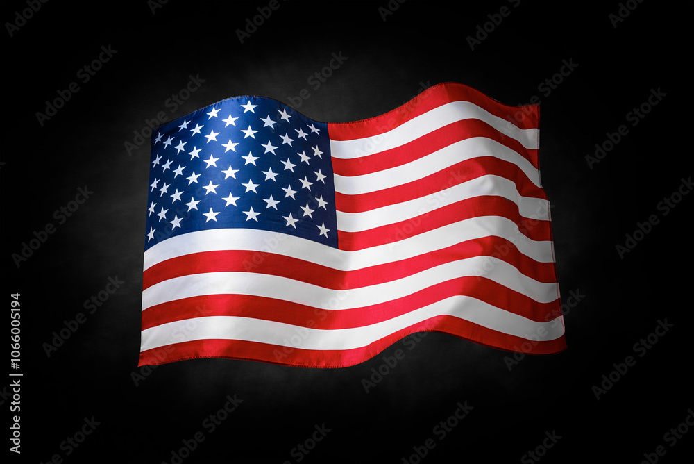 Flag of the United States of America. The US flag flutters in the wind. On a black background.