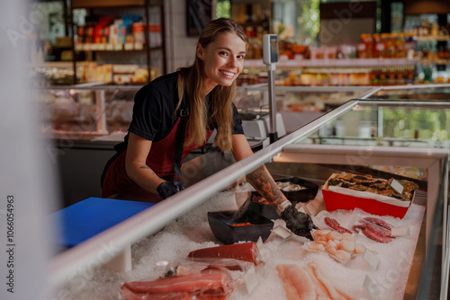 Photos The vibrant seafood market meticulously displays fresh fish, with a cheerful ven