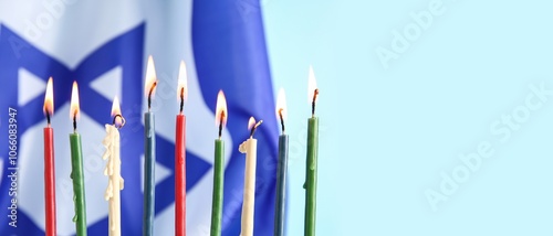 Burning candles with flag o...