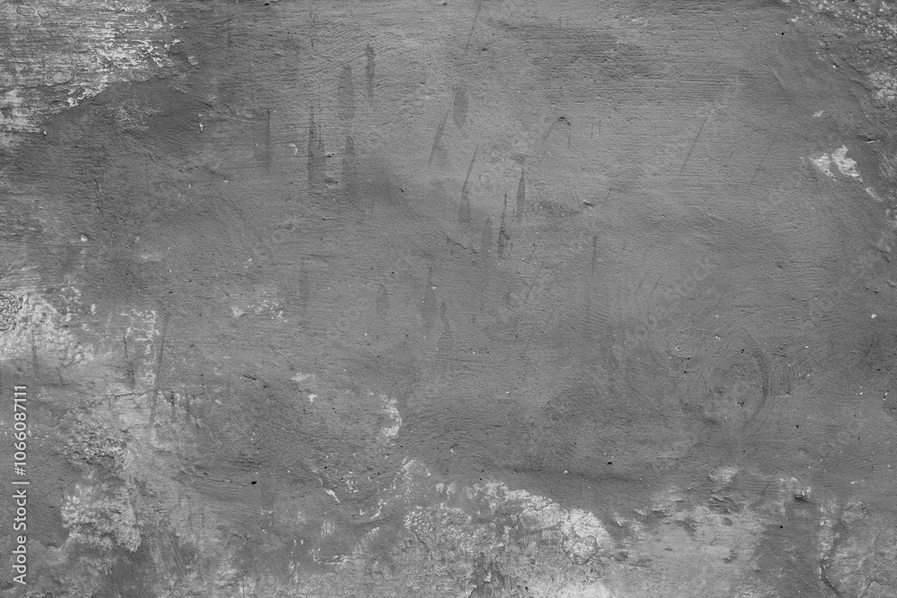 Fototapeta premium Monochrome texture of a concrete wall with natural relief and damage in the form of chips and scratches. Fragment of an old stone surface with a crack. Dark rough surface with a place for an inscripti
