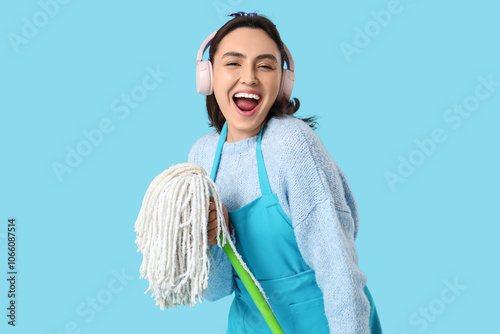 Pretty woman with mop and h...