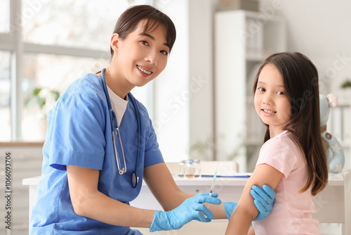 Female doctor vaccinating l...