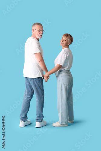 Mature couple holding hands...