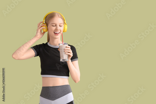Happy sporty young woman in...
