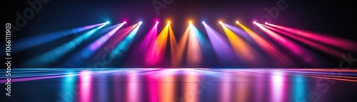 Vibrant Stage Lights in a Dark Theater Setting with Colorful Beams and Reflections on a Glossy Floor