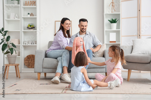 Happy family with toy rabbi...