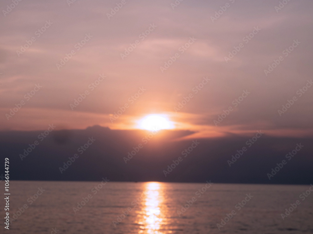 Obraz premium sunset sunrise cloudy white blue sky sea beach vacation holiday nature bright outdoor weather ray sunbeam sunshine season warm relaxation beautiful phenomenon spring idyllic abstract travel trip tour