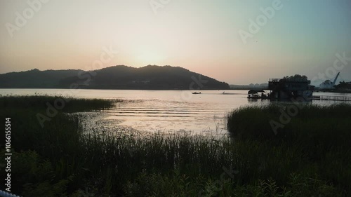 take an aerial shot of the sunset of Sinjungho Lake