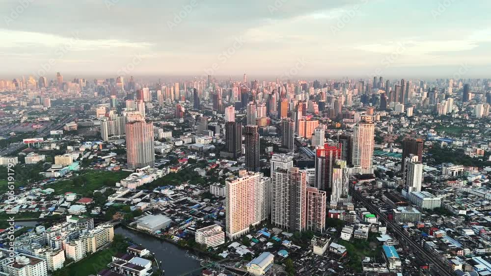 Bangkok aerial view from the Sukhumvit district at sunrise. A large asian capital city with skyscrapers and millions of inhabitants Bangkok aerial view from the Sukhumvit district at sunrise. A large asian capital city with skyscrapers and millions of inhabitants
