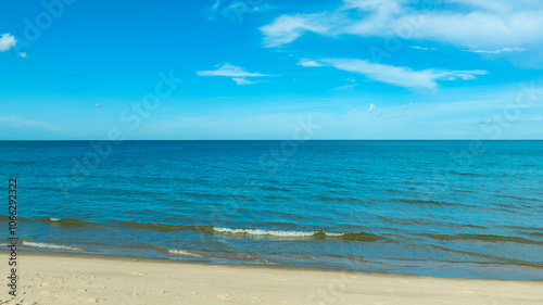 Nature of the beach and sea Summer with sunshine, sandy beaches, clear blue waters sparkling against the blue sky. On an island with good ecology and environment Background for summer vacation concept