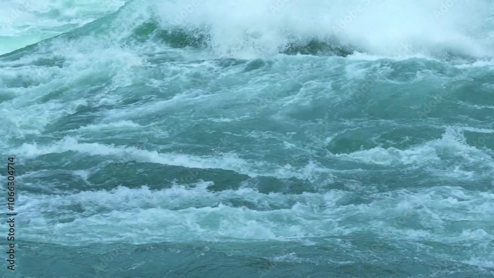 ntense close-up of churning rapids at Niagara Falls, showcasing the powerful and dynamic flow of water in vibrant blue-green hues, power flow of water Niagara Falls ntense close-up of churning rapids at Niagara Falls, showcasing the powerful and dynamic flow of water in vibrant blue-green hues, power flow of water Niagara Falls