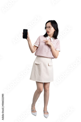 Young Asian woman holding smartphone on blue background