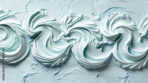 Whipped Cream Swirls on a Light Blue Background photo