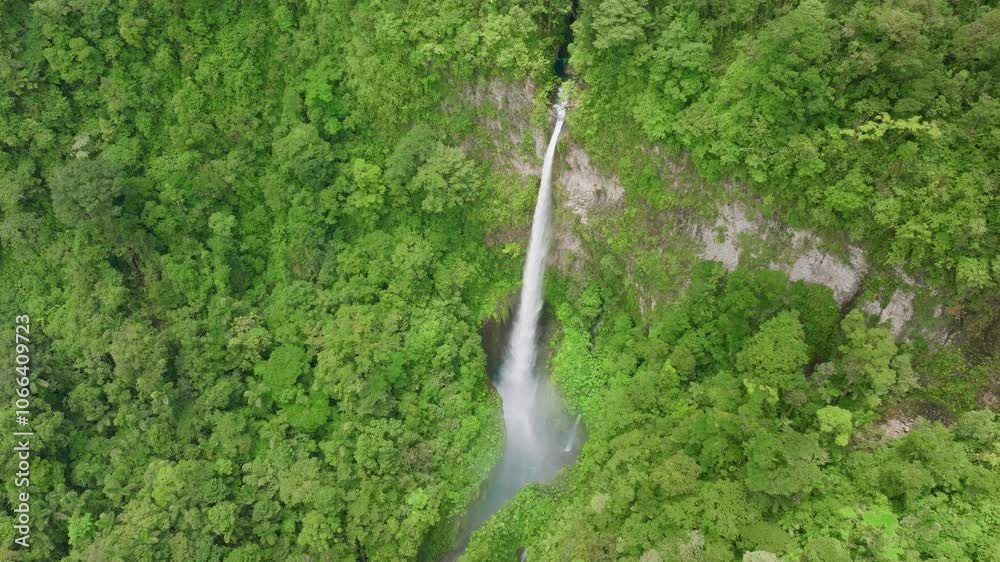 Immerse yourself in the breathtaking beauty of a waterfall nestled in the lush green landscapes of Costa Rica, as it is beautifully captured in stunning and immersive 4K resolution Immerse yourself in the breathtaking beauty of a waterfall nestled in the lush green landscapes of Costa Rica, as it is beautifully captured in stunning and immersive 4K resolution