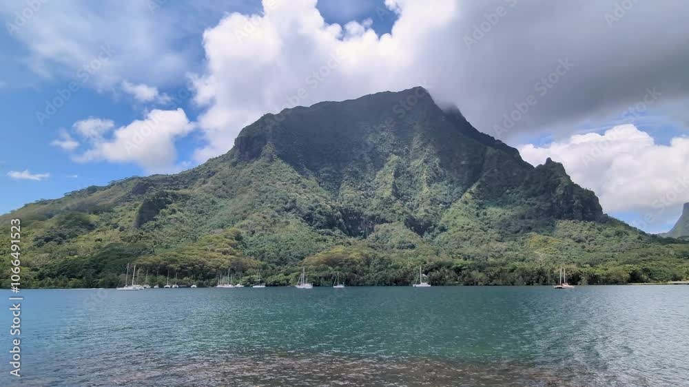 Scenic panoramic view of PaoPao Cook's Bay with ocean, mountains and moored yachts on Moorea Island in French Polynesia, South Pacific Scenic panoramic view of PaoPao Cook's Bay with ocean, mountains and moored yachts on Moorea Island in French Polynesia, South Pacific