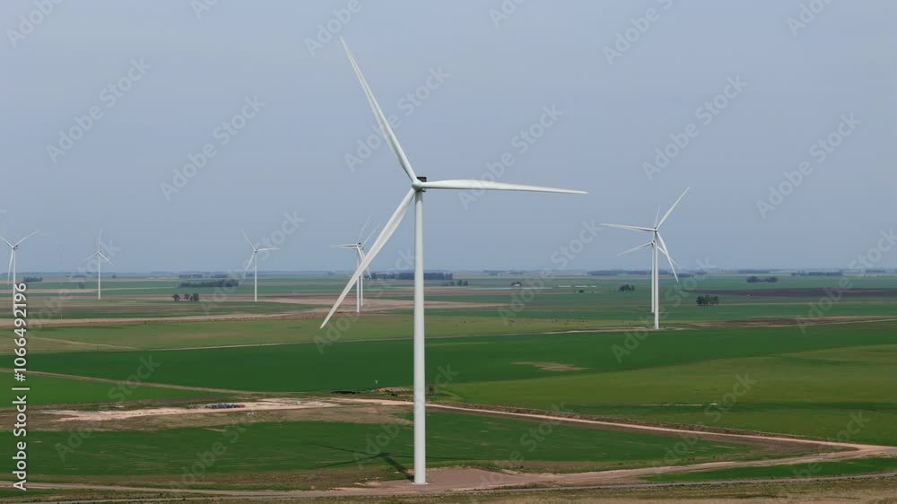 Wide view of green meadow with windmills generating sustainable electricity. Argentina. 4k. Wide view of green meadow with windmills generating sustainable electricity. Argentina. 4k.