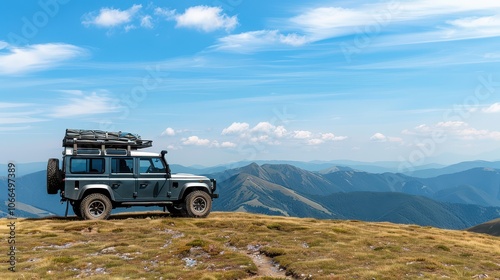 Adventure awaits with a rugged vehicle parked on a mountaintop, surrounded by breathtaking landscapes and open skies. photo