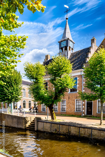 Fotografie Historic town hall at the canal in Balk, Netherlands