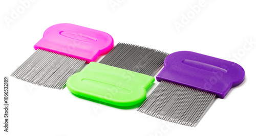 Colorful plastic and metal combs on a white background