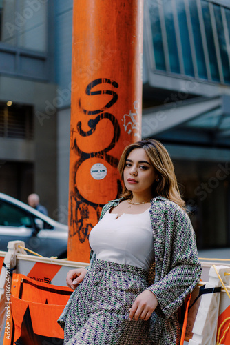 Urban Fashion: Stylish Woman in City Street, Confident and Chic