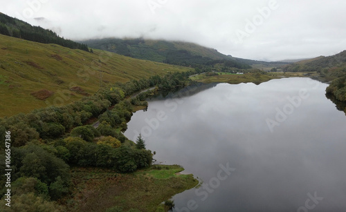 Gorgeous reflection over Loch Lubnaig in Scotland, during a cloudy and misty day. Found this gem during a roadtrip in Scotland. photo