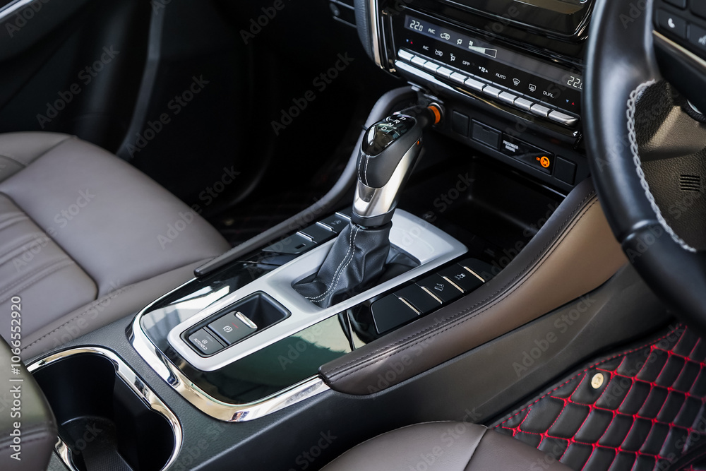 automatic transmission shift selector in the car interior. Closeup a manual shift of modern car gear shifter. 4x4 gear shift