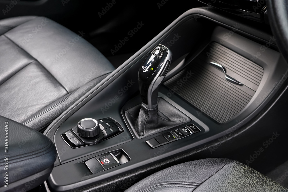 automatic transmission shift selector in the car interior. Closeup a manual shift of modern car gear shifter. 4x4 gear shift automatic transmission shift selector in the car interior. Closeup a manual shift of modern car gear shifter. 4x4 gear shift