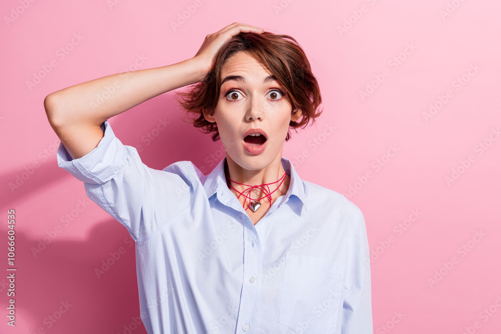 Photo of speechless pretty girl arms touch head open mouth cant believe isolated on pink color background Photo of speechless pretty girl arms touch head open mouth cant believe isolated on pink color background