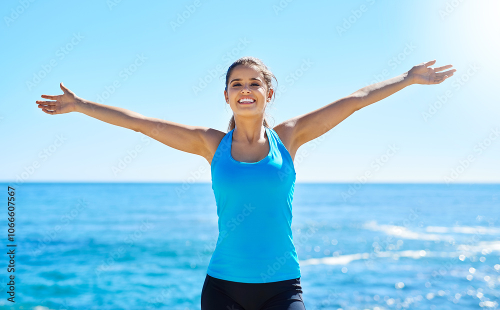 Portrait, smile and woman at beach for freedom, summer workout or sports exercise with blue sky. Ocean, happy and female athlete at sea for wellness, fitness and training routine in Miami nature Portrait, smile and woman at beach for freedom, summer workout or sports exercise with blue sky. Ocean, happy and female athlete at sea for wellness, fitness and training routine in Miami nature