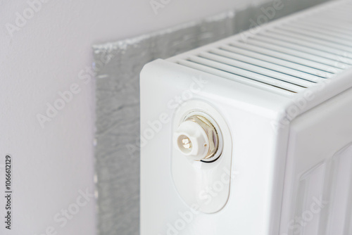 Konstfotografi Thermal insulation panel positioned behind radiator to reflect heat into room