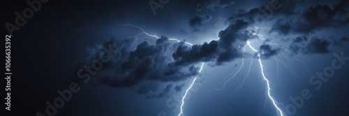 Lightning strikes through dark clouds during a thunderstorm