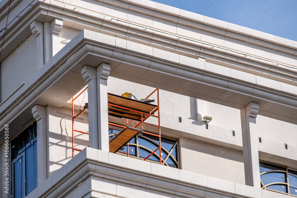 Scaffolding for the renovation of a building with columns. Scaffolding for the renovation of a building with columns.