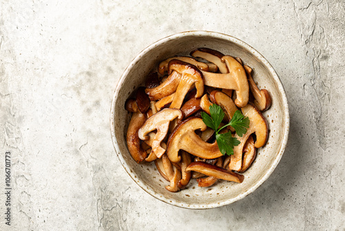 Top view of Fried with garlic oak mushroom. The shiitake or black forest mushrooms is an edible mushroom native to East Asia.