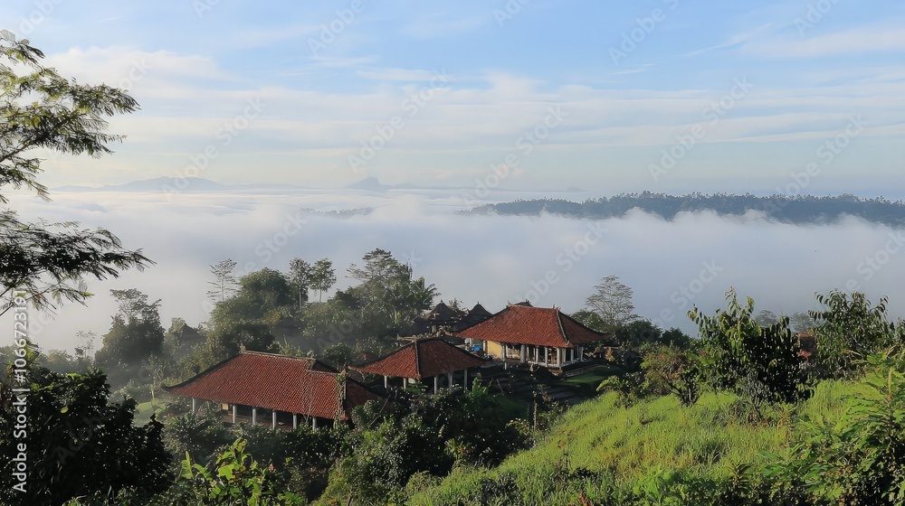 A village nestled in a valley with a sea of clouds below, creating a serene and peaceful scene. A village nestled in a valley with a sea of clouds below, creating a serene and peaceful scene.