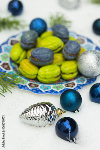 Christmas or New Year green and blue homemade cookies called Nuts stuffed with condensed milk and walnuts surrounded with Christmas balls 