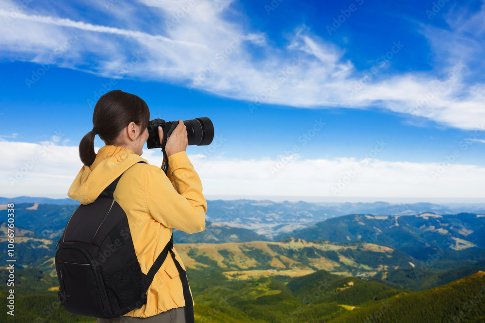 Woman with backpack taking photo in mountains Woman with backpack taking photo in mountains
