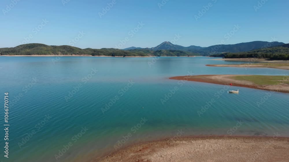 Lake Plastiras Aerial Shot by Shore on a Sunny, Warm Day in Greece Lake Plastiras Aerial Shot by Shore on a Sunny, Warm Day in Greece